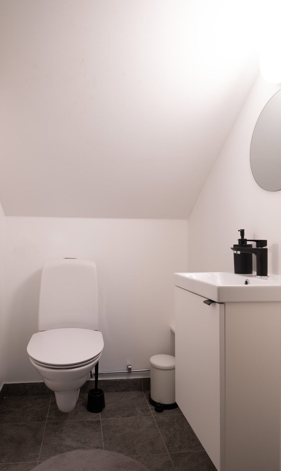 Separate toilet with a washbasin.