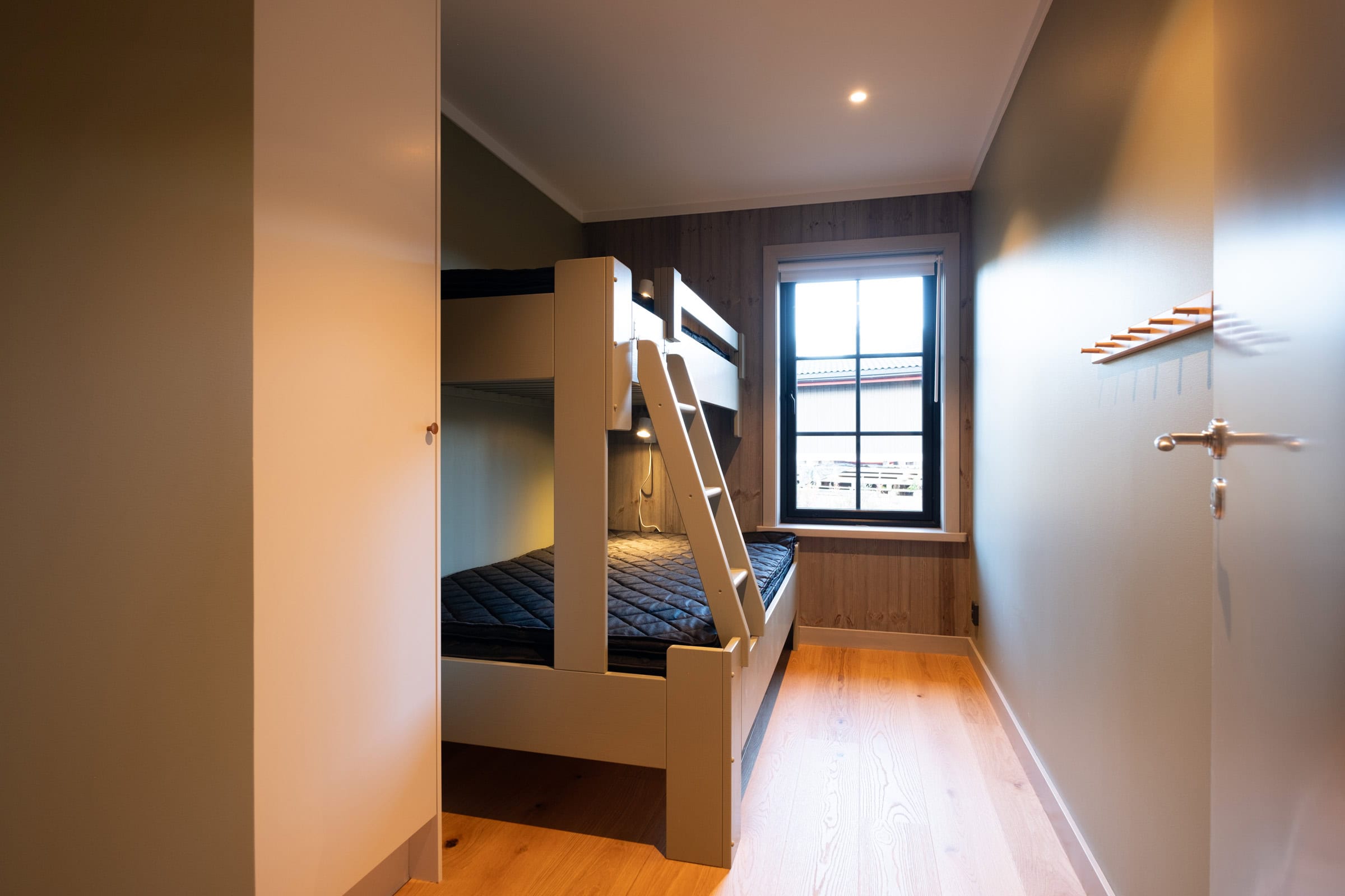 Bedroom with a bunk bed, seen from the doorway
